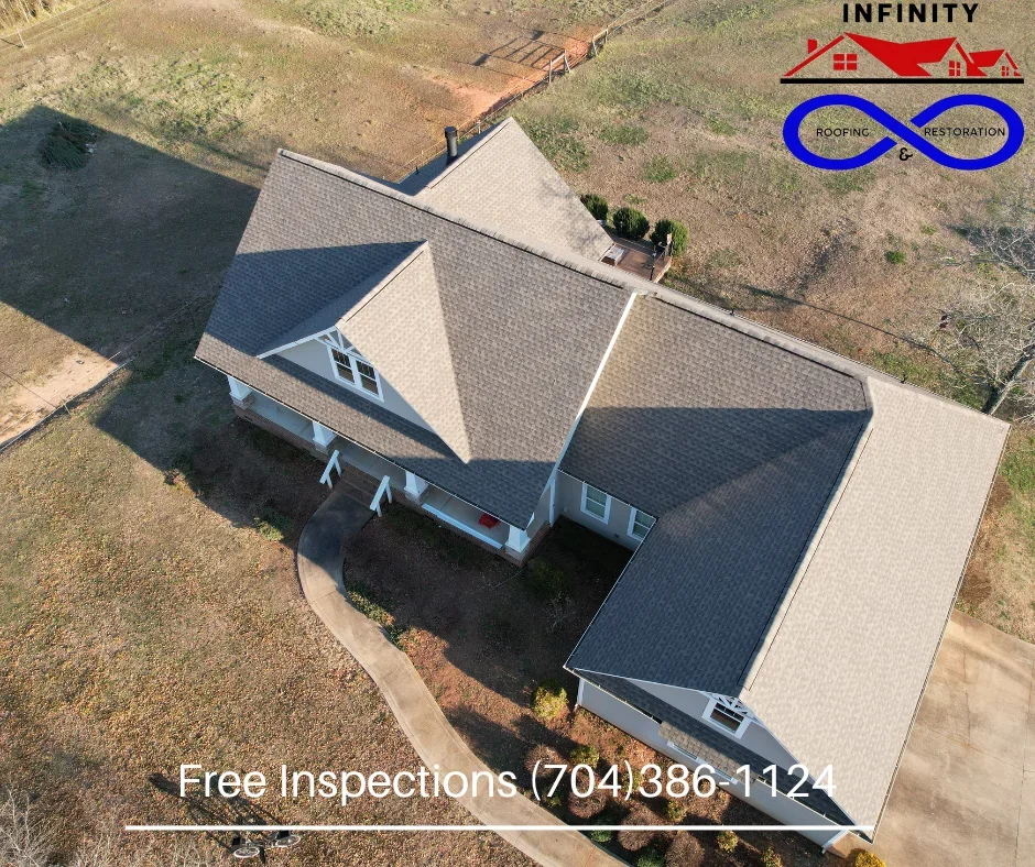 Aerial view of residential home with new gray architectural shingle roof installation in Shelby, NC